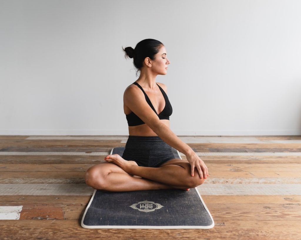 woman-performing-yoga-t1nemsm1rgi
